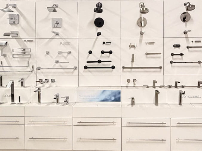 Bathroom cabinet hardware, shower heads and faucets on display at Hughes Supply Monroe NC